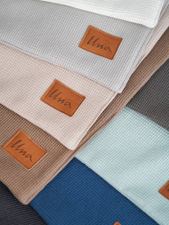 vohvelivaunu_verho_logolla__ecru_light_grey_light_beige_brown_black_dark_green_ice_blue_bueberry